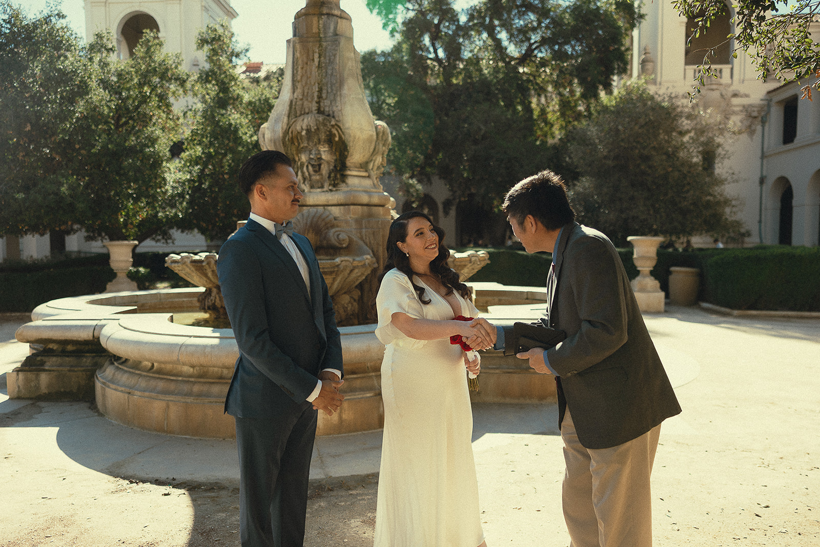 Couple shaking hands with their officiant Will Young from 1 Hour Marriage.