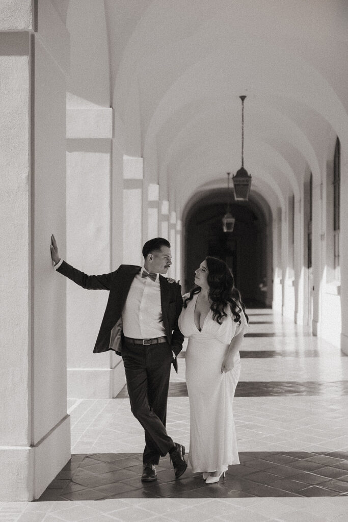 Black and white photo of a couple posing at the Pasadena City Hall