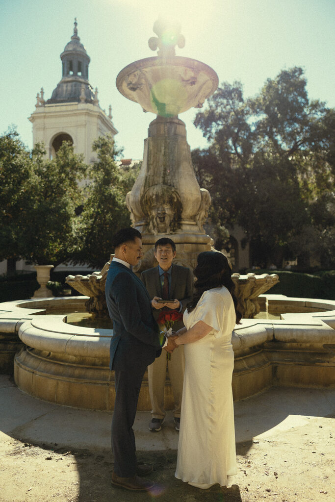 Bride and groom holding hands during their Pasadena City Hall elopement. 