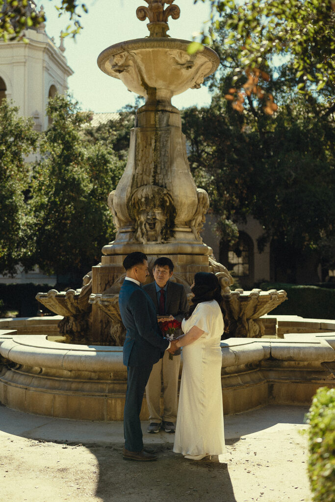 Couple holding hands during their intimate Pasadena City Hall elopement. 