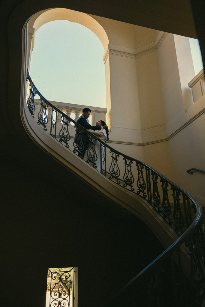 Couples intimate Pasadena City Hall elopement photos on the stiarcase. 