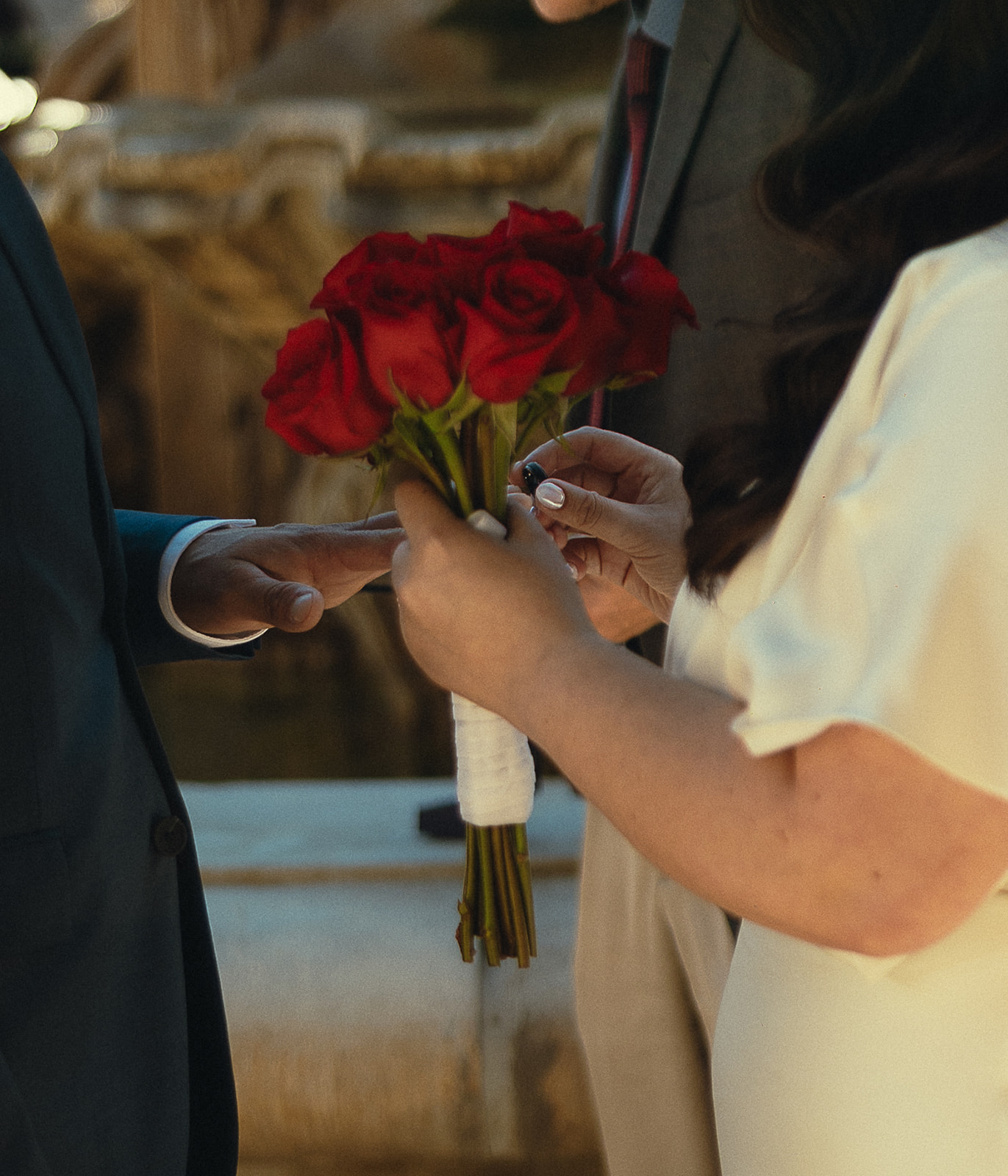 Couple exchanging rings during their intimate elopement ceremony.