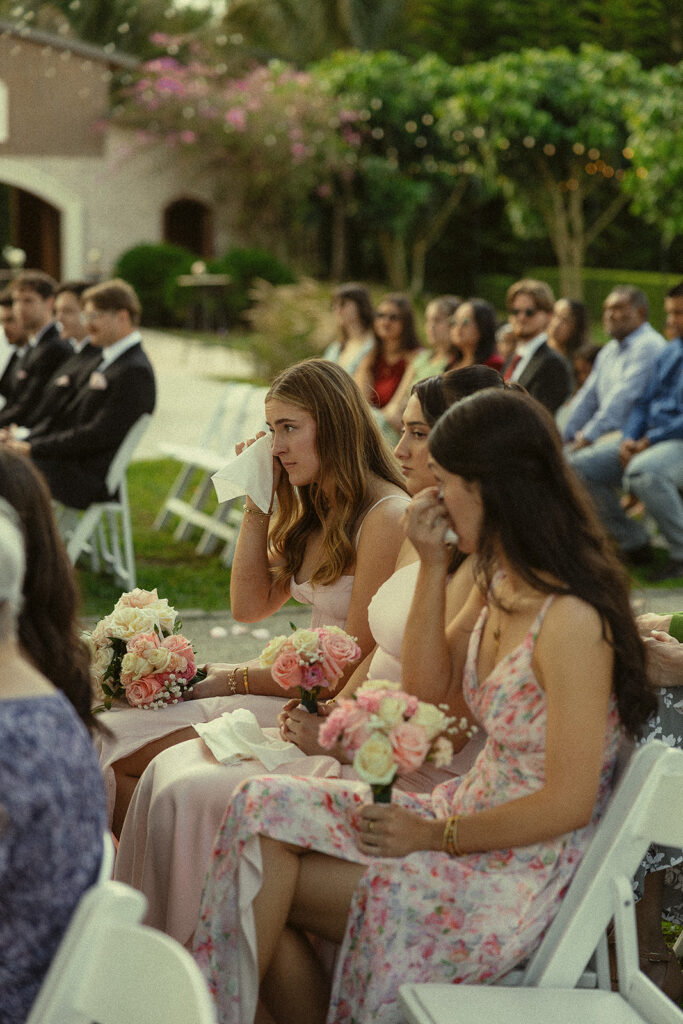 Guests getting emotional during the outdoor wedding ceremony.