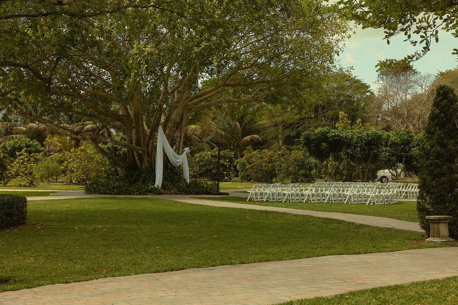 An outdoor wedding ceremony setup from a Miami wedding at Cinco Farm Gardens.