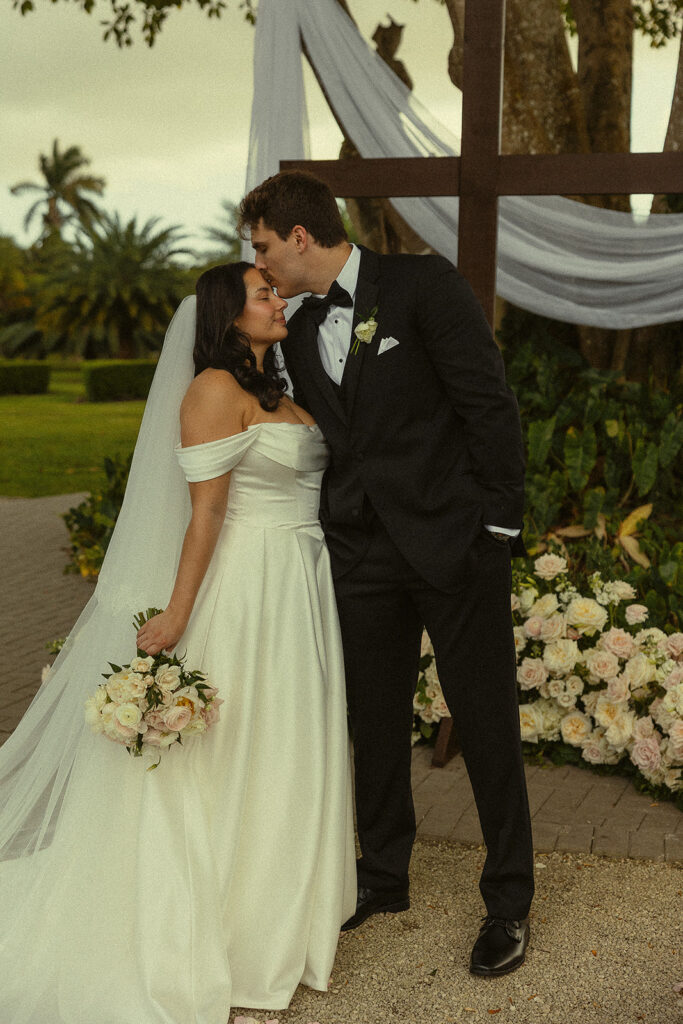 Bride and groom portrait after outdoor wedding ceremony.