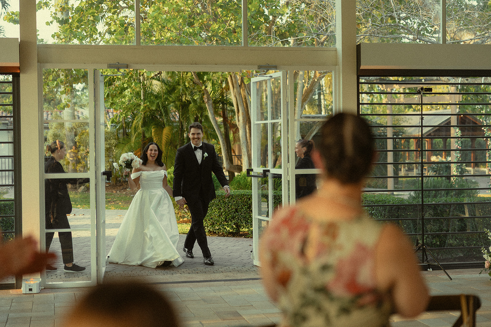 Bride and groom entering their Cinco Farm Gardens wedding reception.