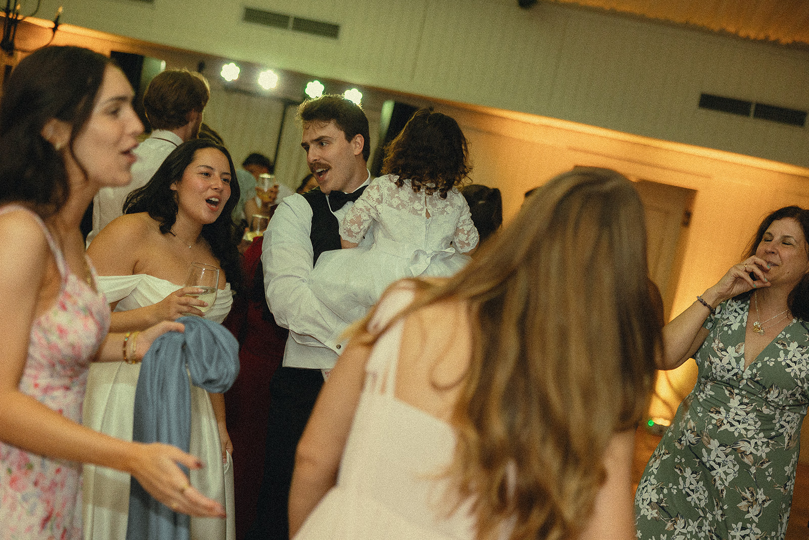 Guests dancing during wedding reception at Cinco Farm Gardens.