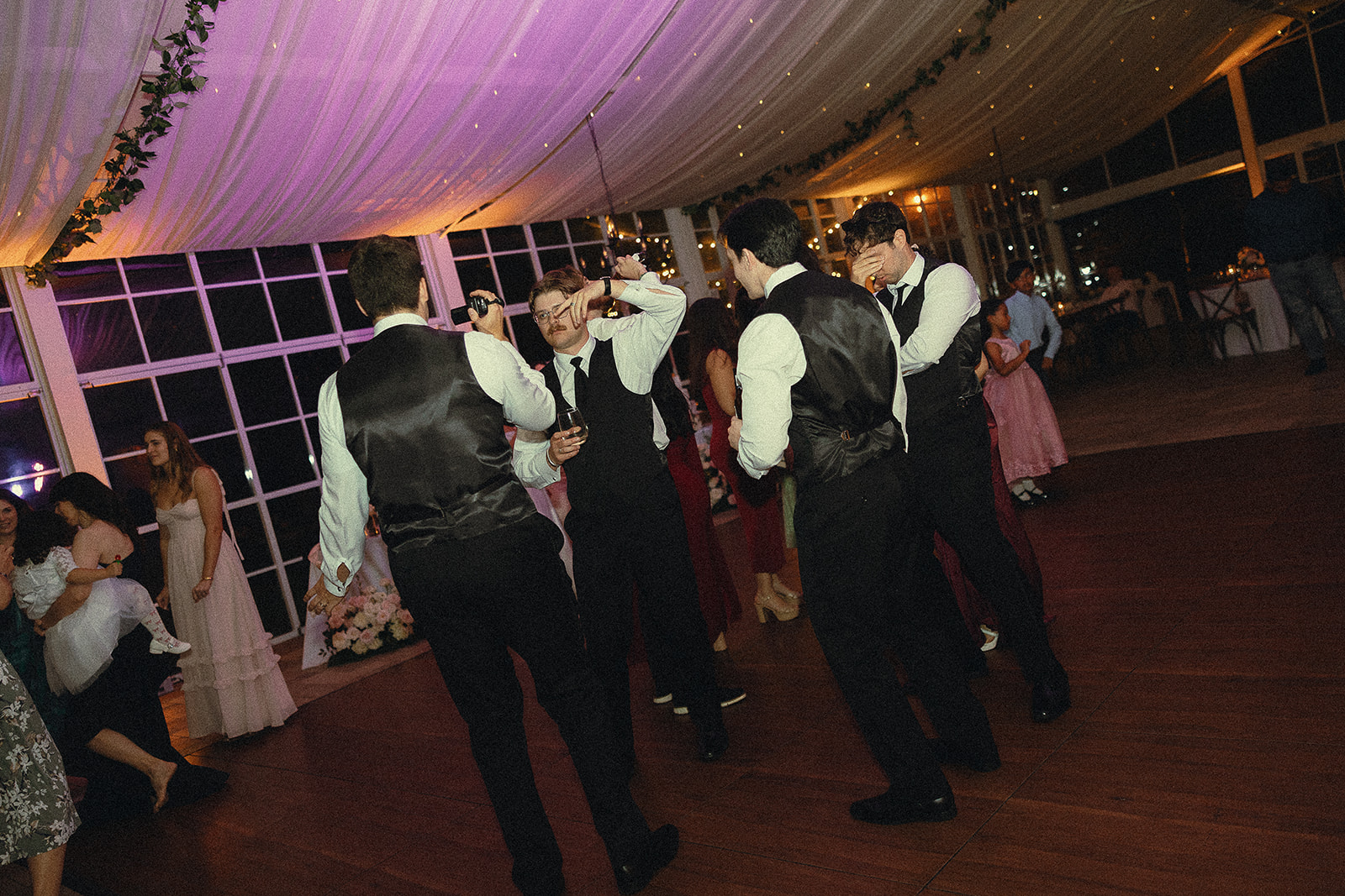 Groomsmen dancing during wedding reception at Cinco Farm Gardens.