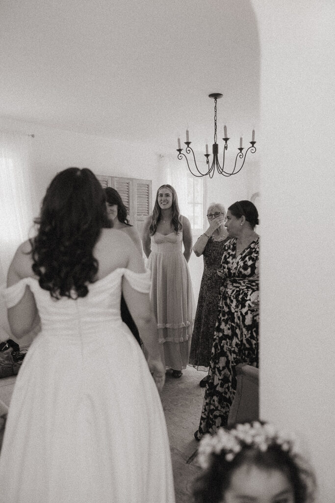 Bride and bridesmaids sharing a first look.