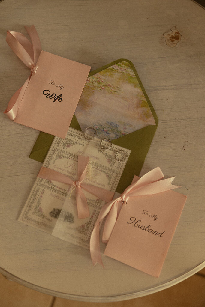 Wedding rings and vow books for a Cinco Farm Gardens wedding.