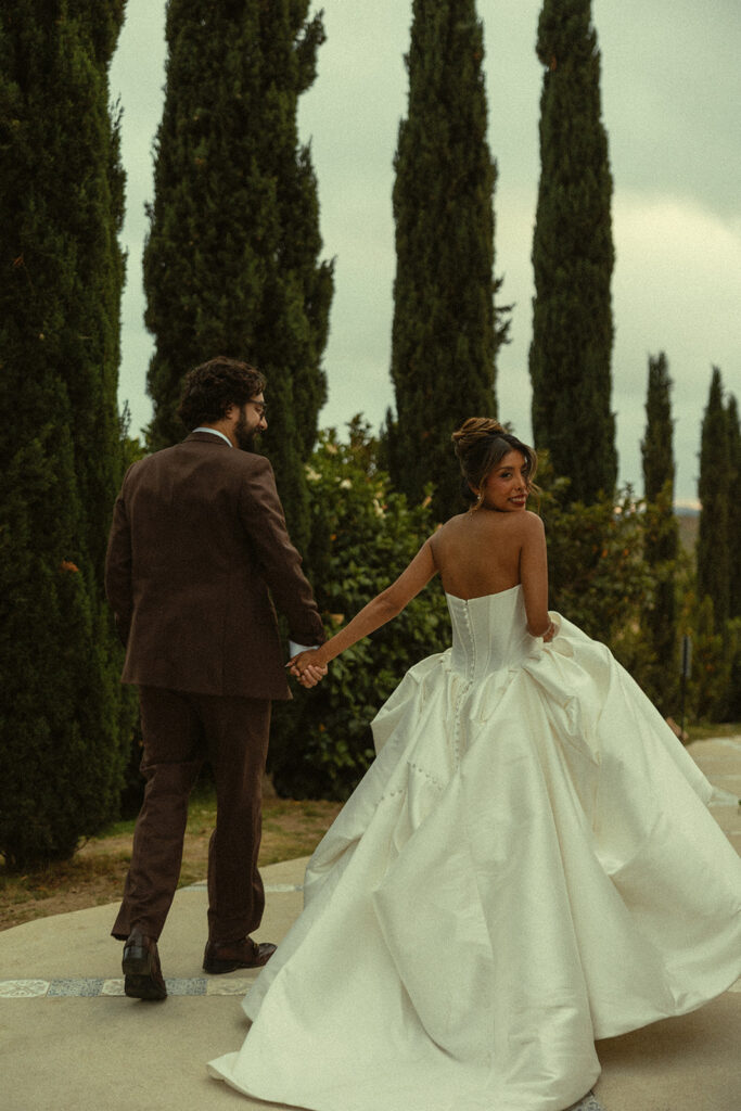 Bride and groom walking outdoors at Jeune Perché.