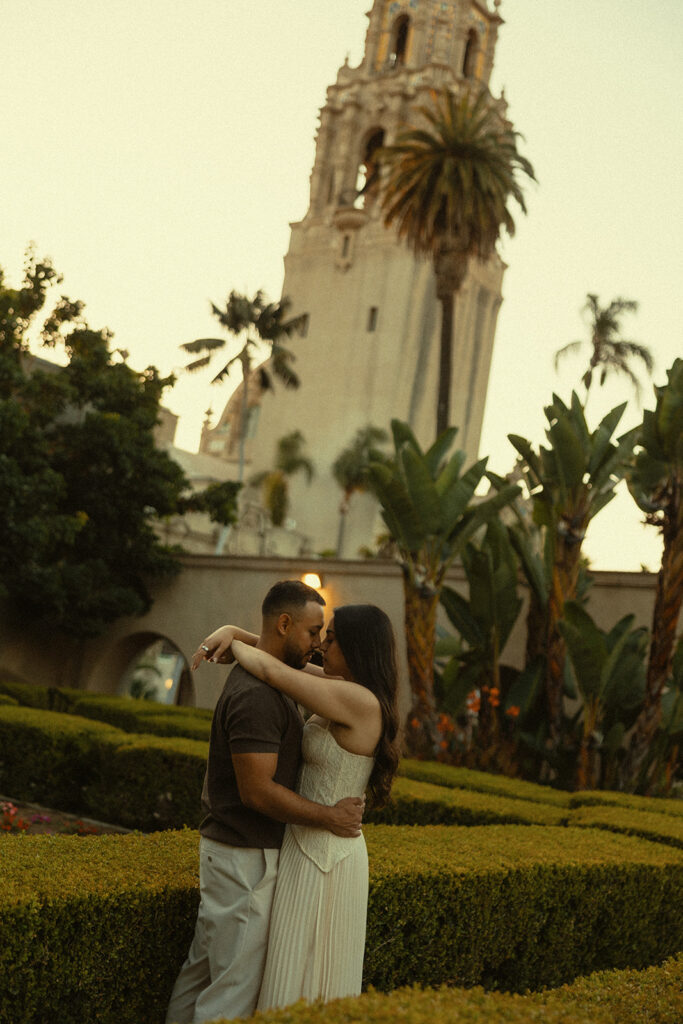 Couple posing in the gardens at Balboa Park.