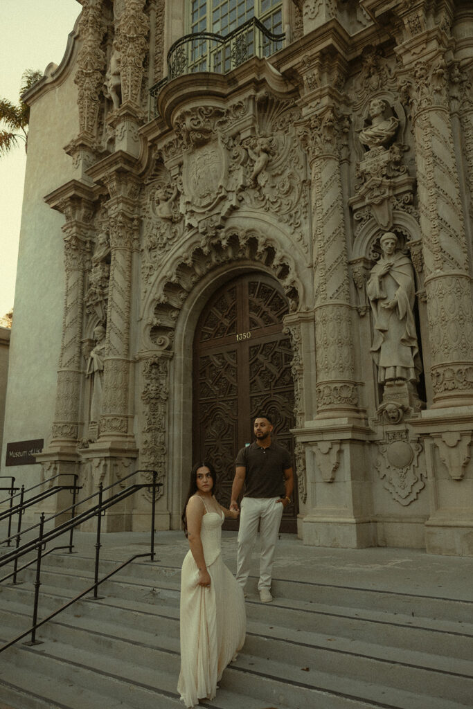 Couple posing outside the Museum of Us.