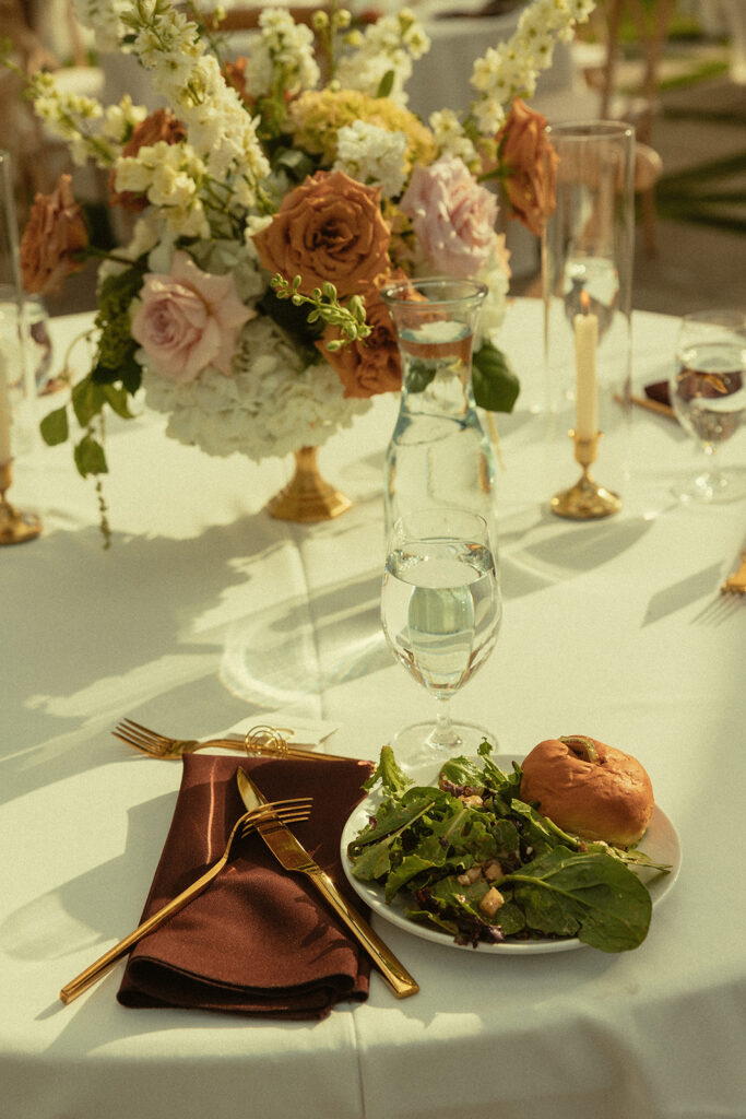 Close up of food and a wedding reception tablescape.