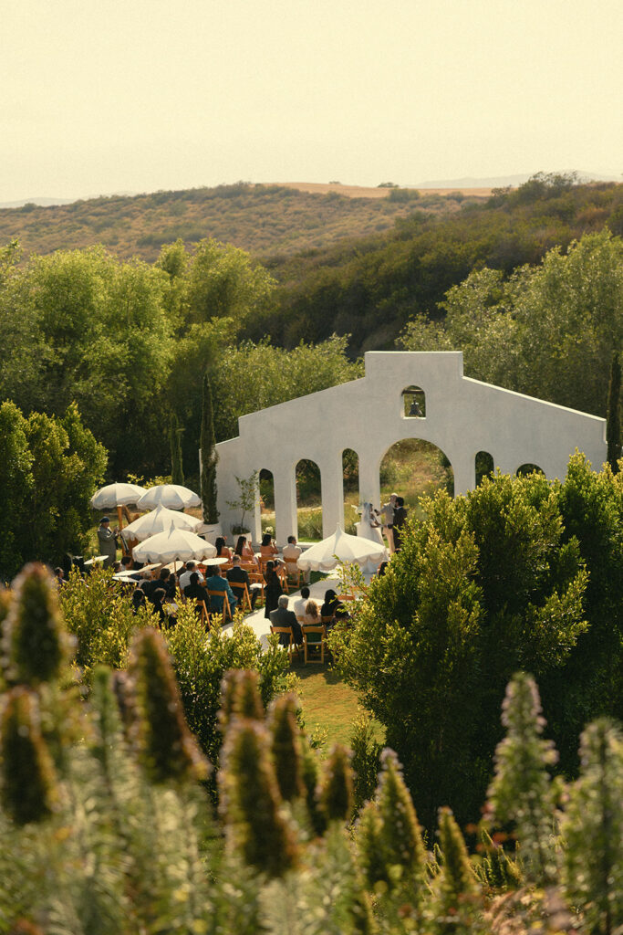 Overhead faraway shot of an outdoor Jeune Perché wedding ceremony.