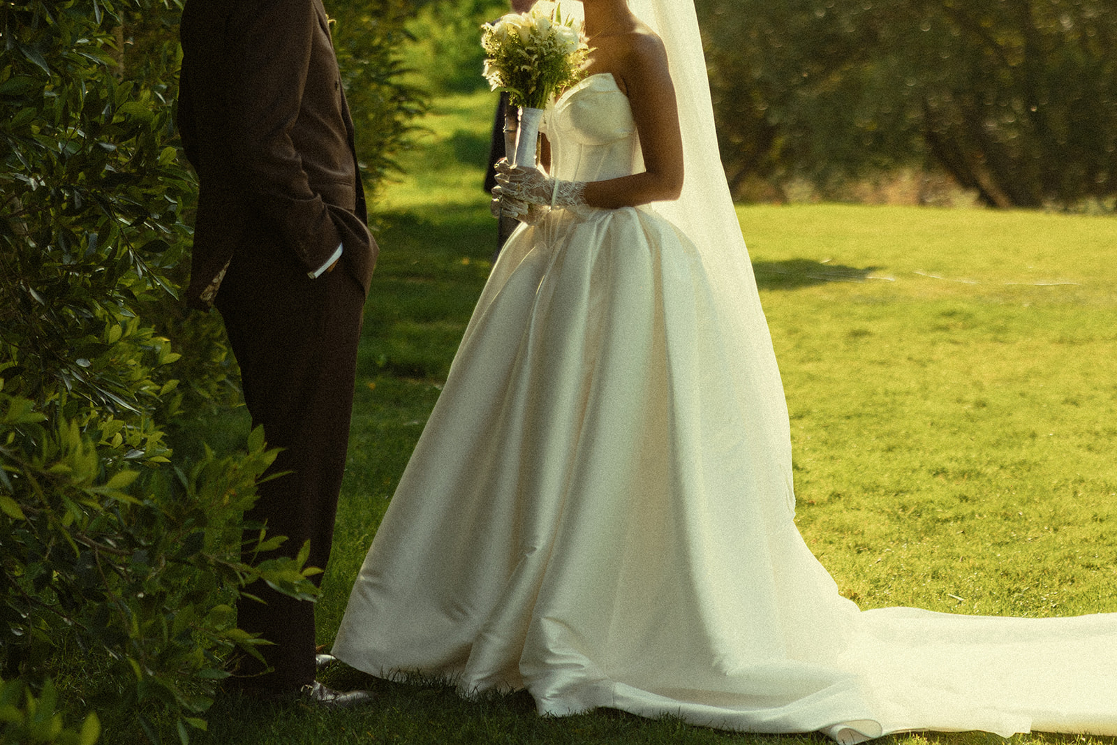 Close up shot of a bride and groom posing in the outdoor area at Jeune Perché.